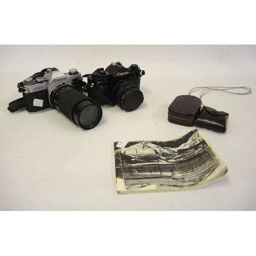 206 - Canon AE1 35mm camera, together with a Canon A1 35mm camera and a small quantity of accessories