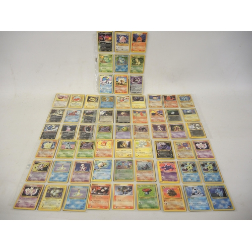 222 - Seven double sided sheets housing a collection of mainly ' Holo ' Pokémon cards including Fossil, Ju... 