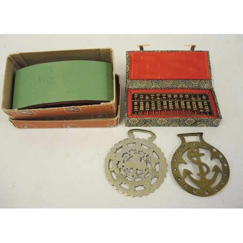 231 - Mid 20th Century Chinese miniature brass abacus in a fabric covered case, together with a leather bl... 