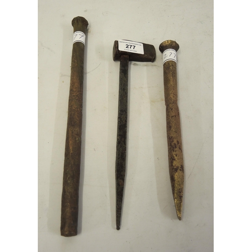 277 - Two antique copper ship's nails, together with a related caulking tool