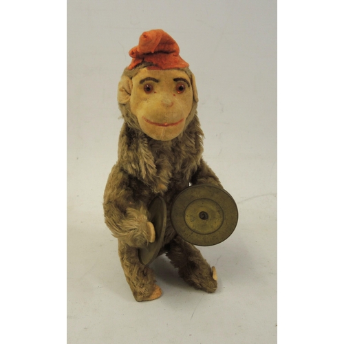 292 - Early 20th Century plush covered clockwork toy monkey playing cymbals, 20cm high approximately