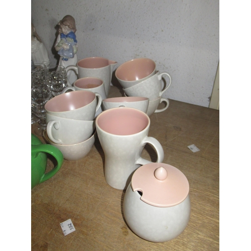 373 - Forty plus pieces of Poole pottery twin tone tea and dinnerware including two teapots etc