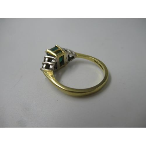 571 - 18ct Gold emerald and diamond set dress ring, the centre stone approximately 6mm square