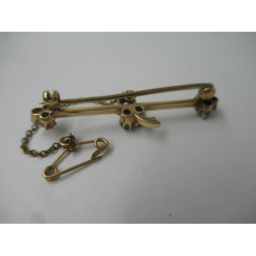 592 - Yellow metal and nine stone old cut diamond set tie pin / bar brooch