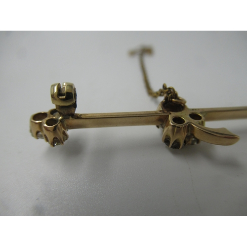 592 - Yellow metal and nine stone old cut diamond set tie pin / bar brooch