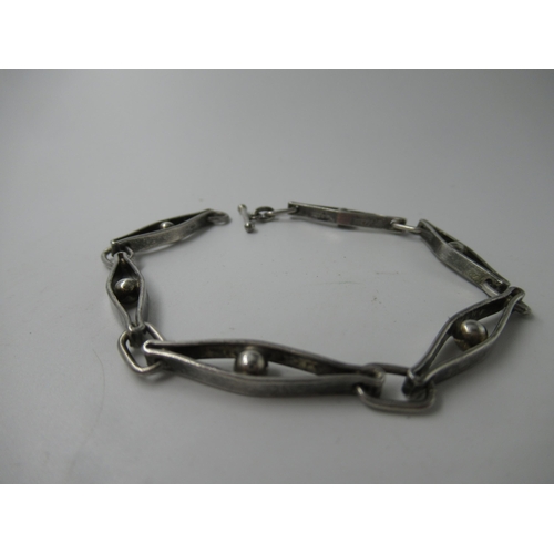 608 - Small Georg Jensen silver bracelet of alternating link design, with hallmarks and makers marks, stam... 