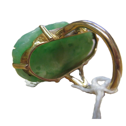 619A - 9ct Yellow gold mounted ring set with pierced and floral carved jade, size 'J'