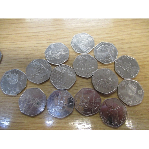 620B - Tin containing a large collection of scarce 50p circulated collectors coins, including Olympics 2012... 