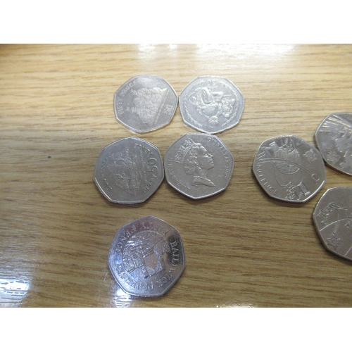 620B - Tin containing a large collection of scarce 50p circulated collectors coins, including Olympics 2012... 