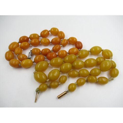 627 - Small butterscotch amber bead necklace, 37g, together with a yellow amber bead necklace, 42g