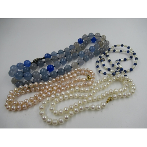 630 - Two cultured pearl necklaces, freshwater pearl and lapis lazuli necklace and a glass bead necklace