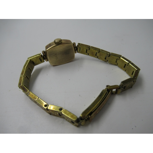 649 - Ladies 9ct gold cased wristwatch on a metal bracelet