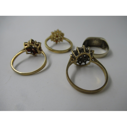 652 - 14ct Gold dress ring, 3gm, together with two 9ct gold cluster rings, 5.2gm, and a similar unmarked y... 