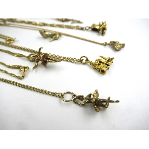 662 - Six 9ct gold charms each on a fine 9ct gold chain, 21gm