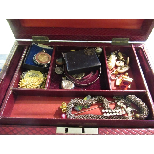 666 - Leather covered box containing a collection of various costume jewellery including silver medals etc... 