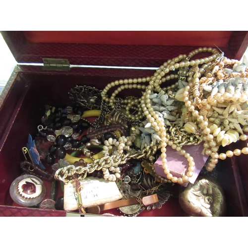 666 - Leather covered box containing a collection of various costume jewellery including silver medals etc... 