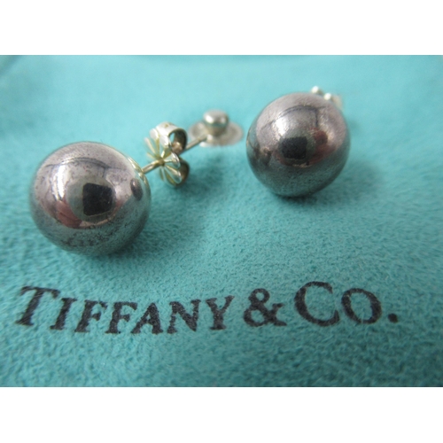 681 - Three pairs of Tiffany silver earrings in original pouches