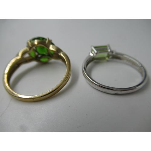 695 - 9ct White gold peridot and diamond chip set ring, and a 9ct yellow yellow gold gemstone set ring