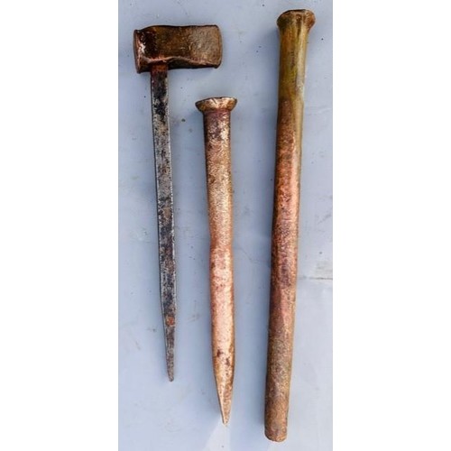 277 - Two antique copper ship's nails, together with a related caulking tool