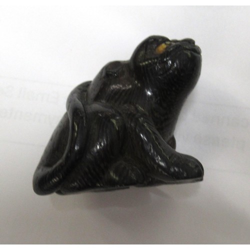 144 - Japanese carved boxwood netsuke in the form of an animal, signed to the base