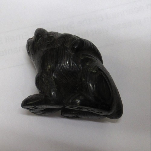 144 - Japanese carved boxwood netsuke in the form of an animal, signed to the base