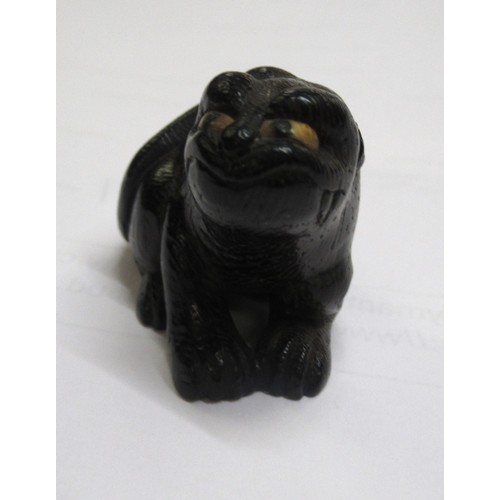 144 - Japanese carved boxwood netsuke in the form of an animal, signed to the base