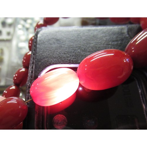 648 - Cherry coloured amber bead necklace, a Venetian glass bead necklace, together with a quantity of oth... 