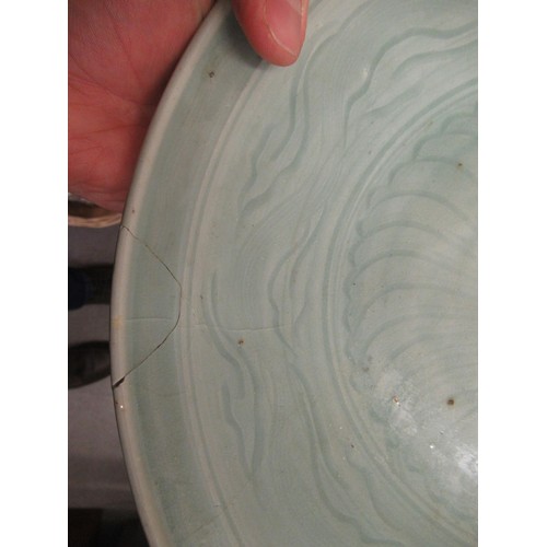 312 - Chinese Celadon circular deep dish with shallow incised decoration, 32cm diameter, with a hardwood s... 