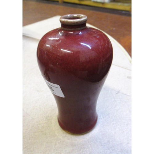 405 - Chinese Sang de Boeuf baluster form stoneware vase, 15cm high