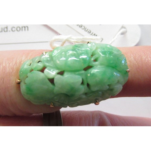 619A - 9ct Yellow gold mounted ring set with pierced and floral carved jade, size 'J'