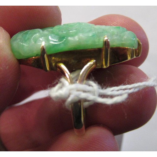 619A - 9ct Yellow gold mounted ring set with pierced and floral carved jade, size 'J'