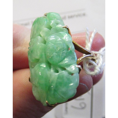 619A - 9ct Yellow gold mounted ring set with pierced and floral carved jade, size 'J'