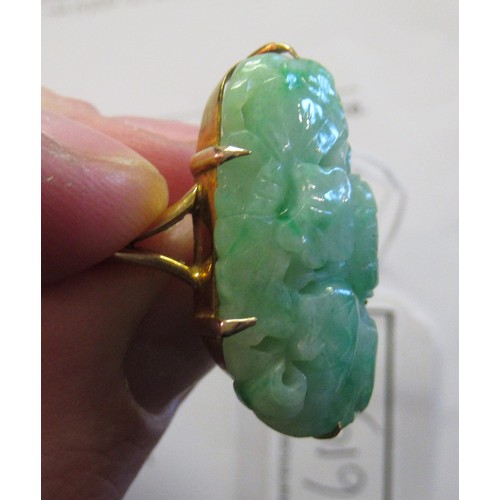 619A - 9ct Yellow gold mounted ring set with pierced and floral carved jade, size 'J'