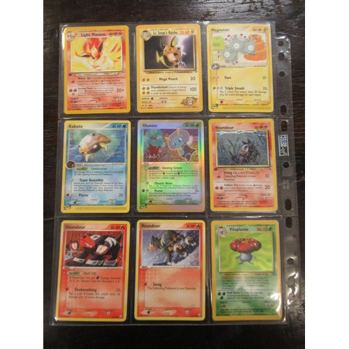 222 - Seven double sided sheets housing a collection of mainly ' Holo ' Pokémon cards including Fossil, Ju... 