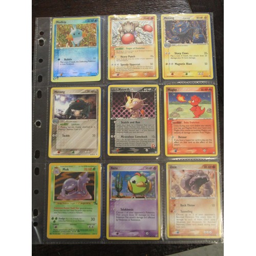 222 - Seven double sided sheets housing a collection of mainly ' Holo ' Pokémon cards including Fossil, Ju... 