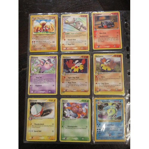 222 - Seven double sided sheets housing a collection of mainly ' Holo ' Pokémon cards including Fossil, Ju... 