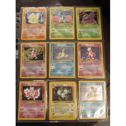 222 - Seven double sided sheets housing a collection of mainly ' Holo ' Pokémon cards including Fossil, Ju... 