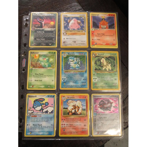 222 - Seven double sided sheets housing a collection of mainly ' Holo ' Pokémon cards including Fossil, Ju... 