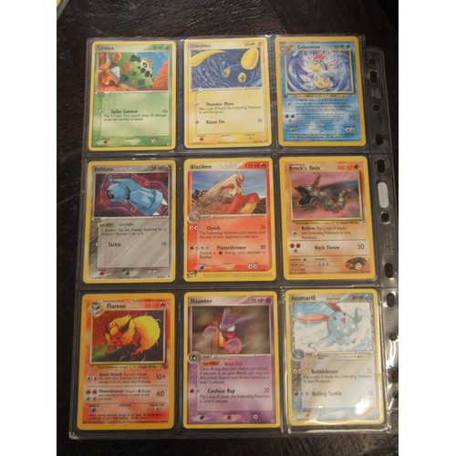 222 - Seven double sided sheets housing a collection of mainly ' Holo ' Pokémon cards including Fossil, Ju... 