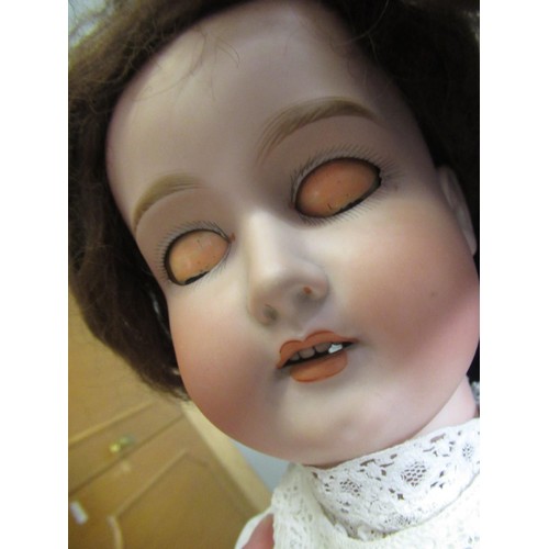 97 - Late 19th / early 20th Century bisque headed doll with a jointed composition body, sleeping eyes and... 