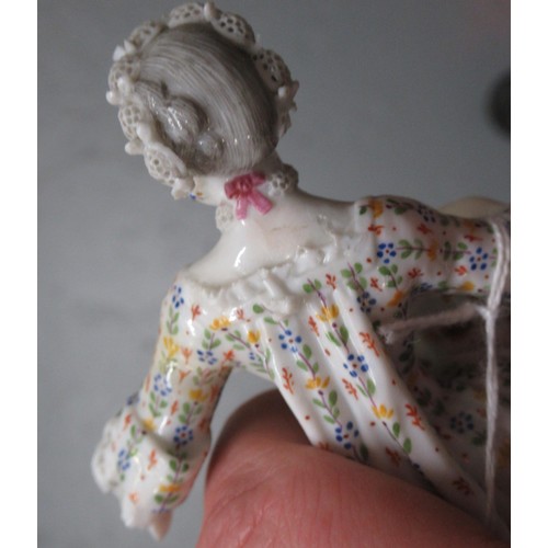 349 - Small late Meissen figure of a seated lady with cat, 13cm high