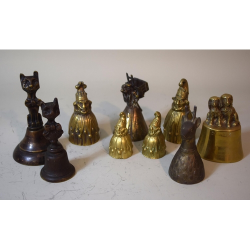 1019 - Group of four brass Punch bells, together with five other brass and bronze animal form bells