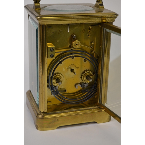 1048 - French gilt brass carriage clock, the enamel dial with Roman numerals, with a two train movement str... 