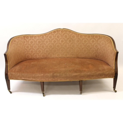 1194 - George III mahogany humpback sofa with moulded frame on square reeded supports with later casters, 1... 