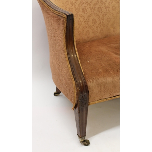 1194 - George III mahogany humpback sofa with moulded frame on square reeded supports with later casters, 1... 