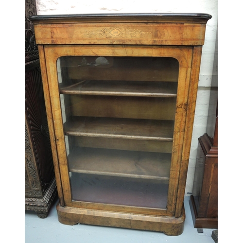 1229 - Victorian figured walnut and marquetry inlaid pier cabinet with a single glazed panel door enclosing... 