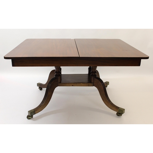 1372 - Unusual late Regency mahogany rectangular extending dining table, the tilt top above a large quadrup... 