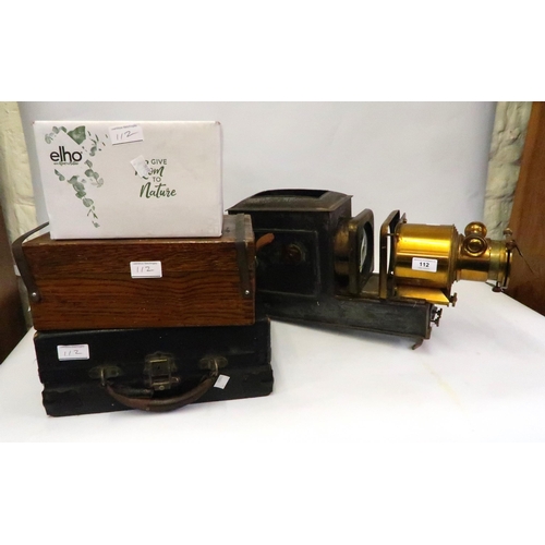 112 - 19th Century brass and black japanned magic lantern, together with a quantity of loose glass slides ... 