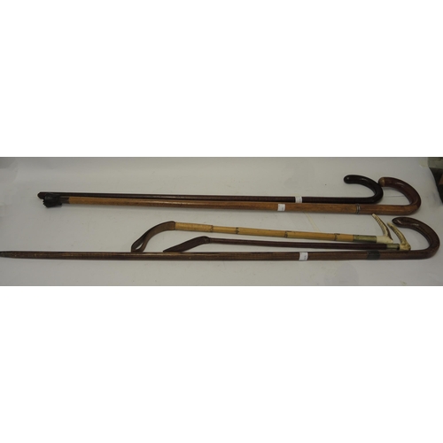 120B - Antique Malacca swordstick, two riding crops with antler handles and two other sticks