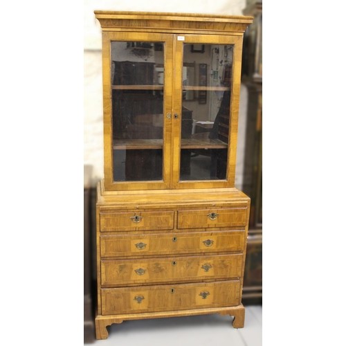 1392 - 18th Century and later walnut two door bookcase, having moulded top with adjustable shelves, the bas... 